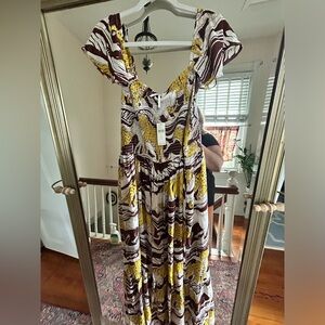 By Anthropologie. Beachy dress, very light fabric, tiger images print